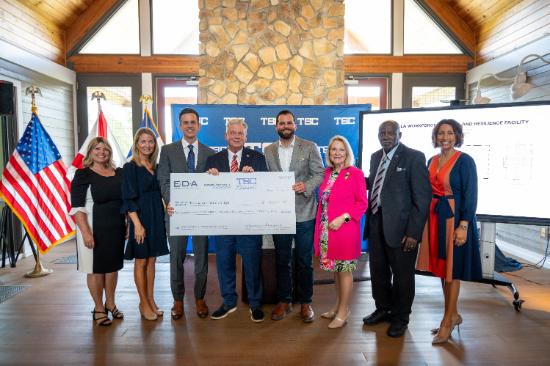 Board of Trustees members and dignitaries with $27 million check