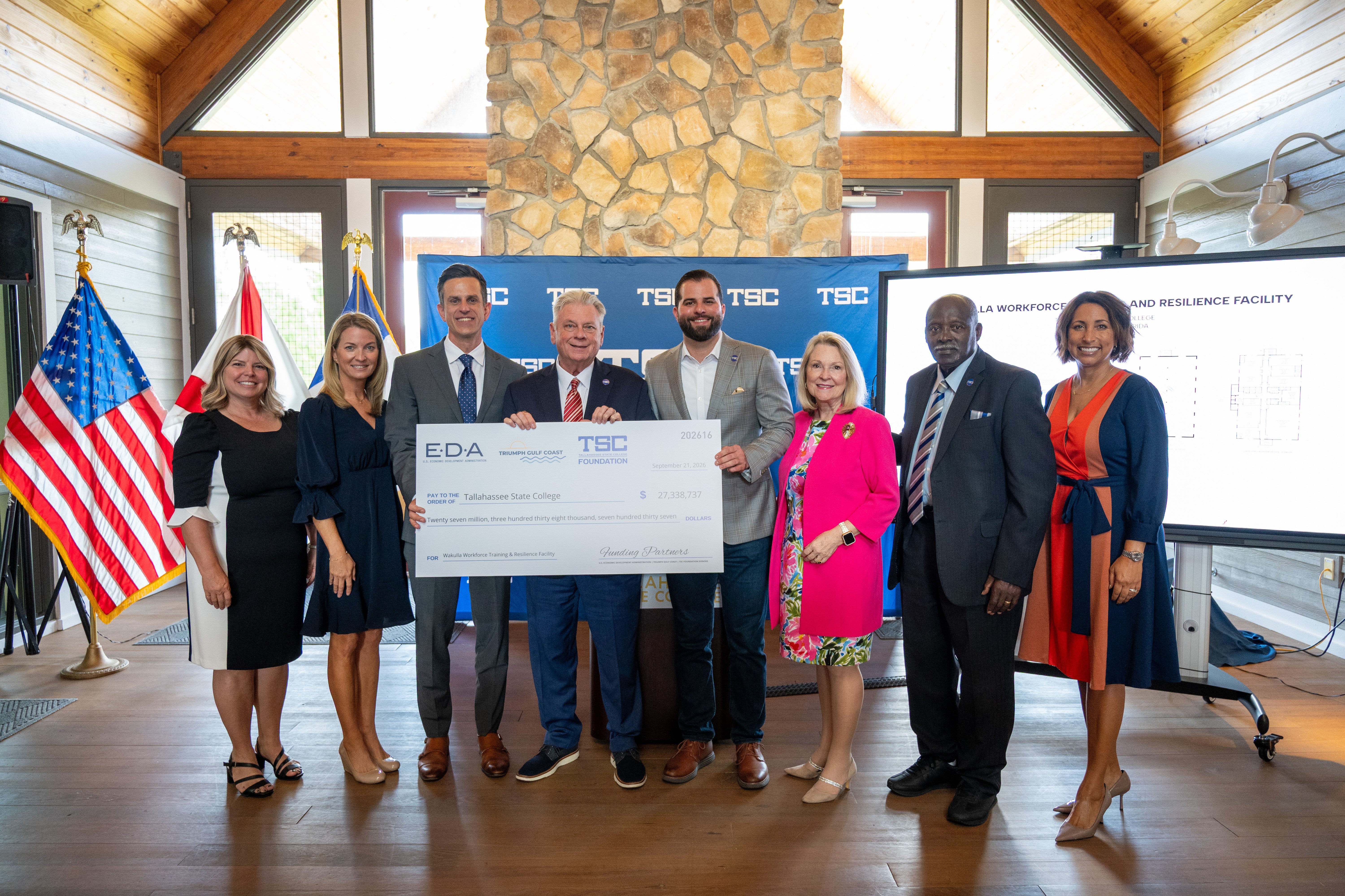 Board of Trustees members and dignitaries with $27 million check