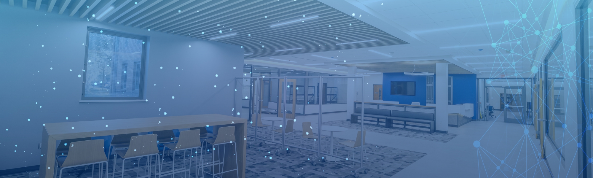 Tables, chairs, and resting/study area in the Innovation Hub.