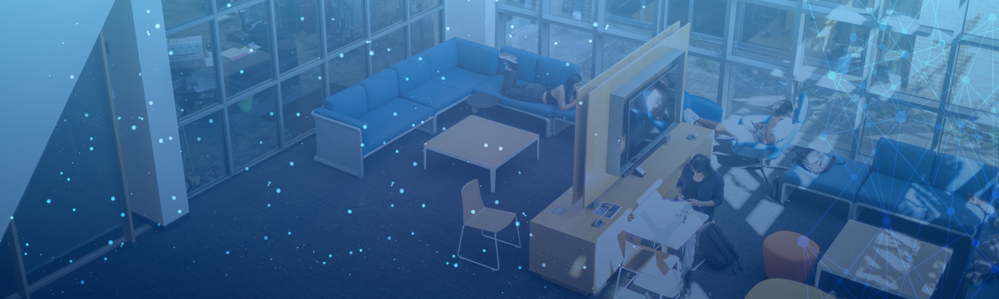 Student Union lobby photographed from above with blue technology graphics.
