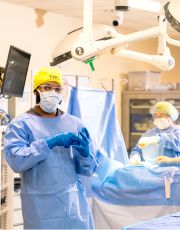 TSC students in scrubs in surgical technology lab.