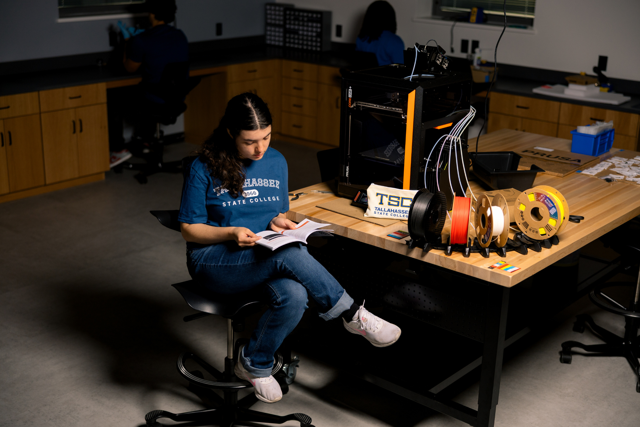 student reading 3d printer instructions