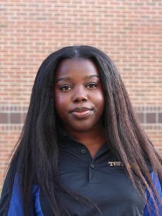 A young woman smiling