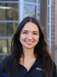 A young woman smiling