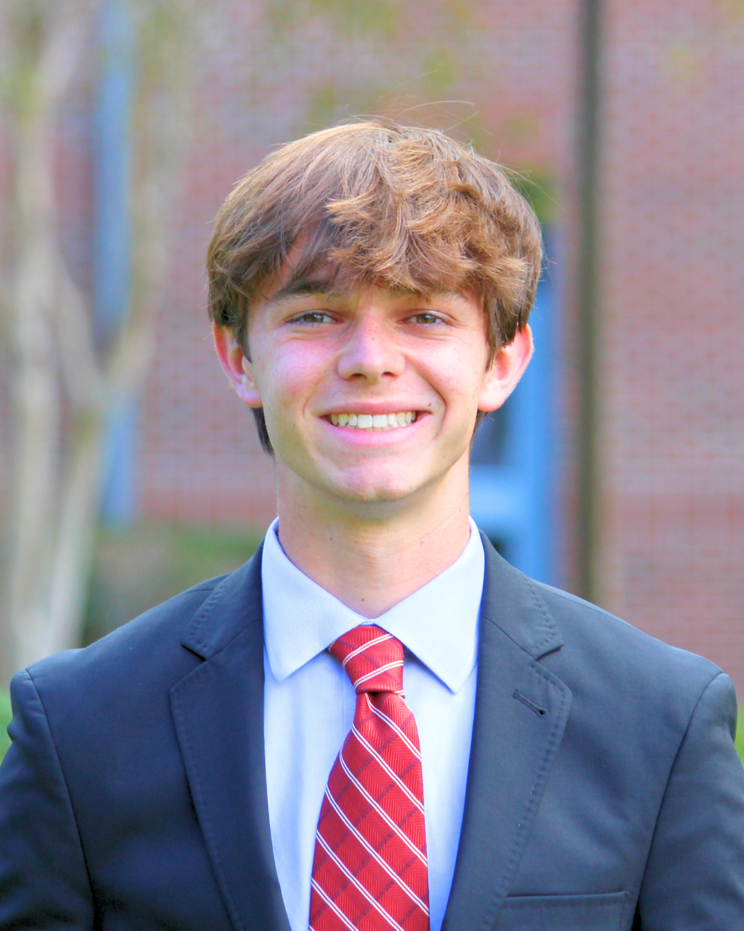 A young man smiling