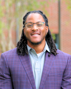 A young man smiling