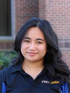 A young woman smiling